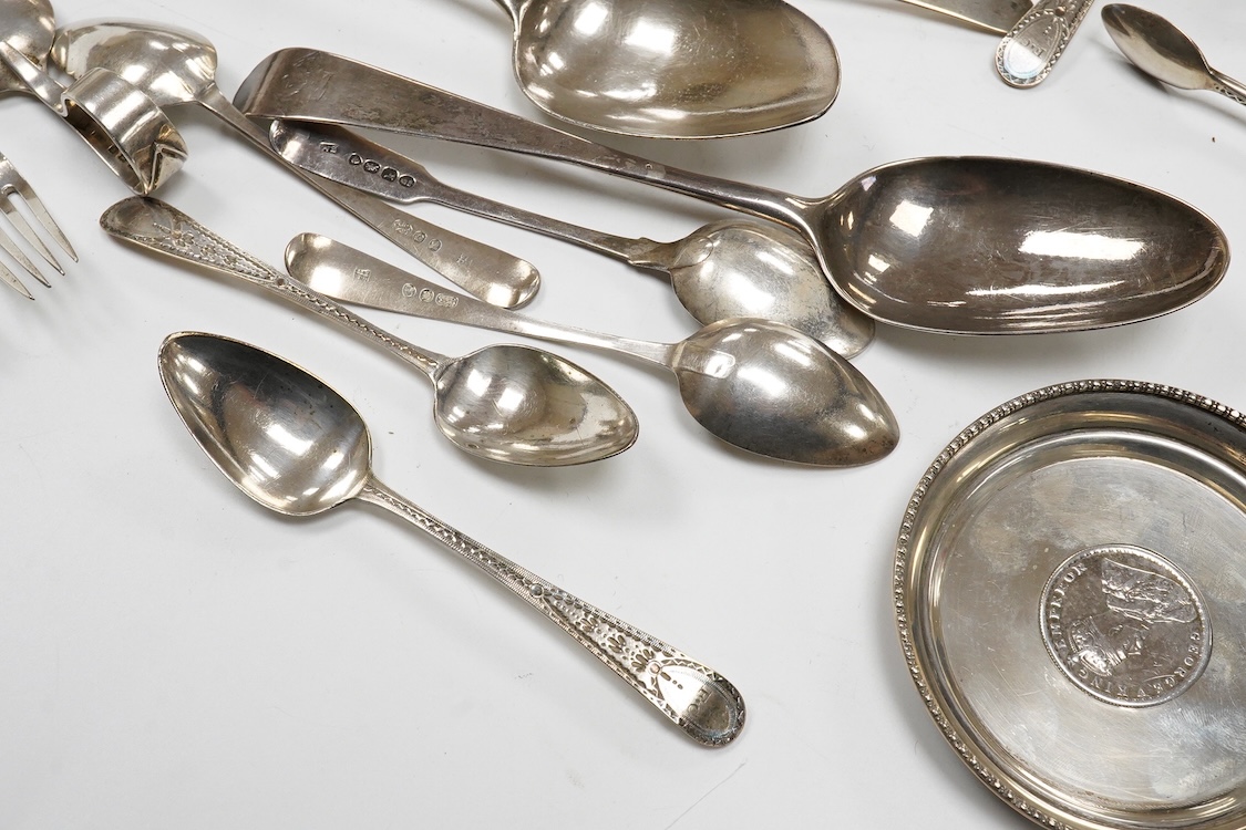 A collection of small silver and white metal items, including an Indian Hamilton & Co small dish, the centre inset with 1840 one rupee coin, one other white metal dish, two modern silver mounted napkin rings, fourteen as